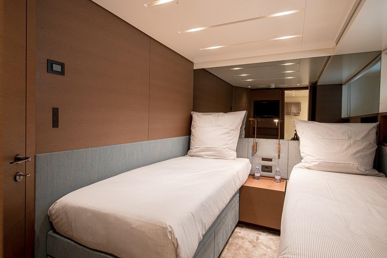 a room with two beds aboard REGINE Yacht for Sale