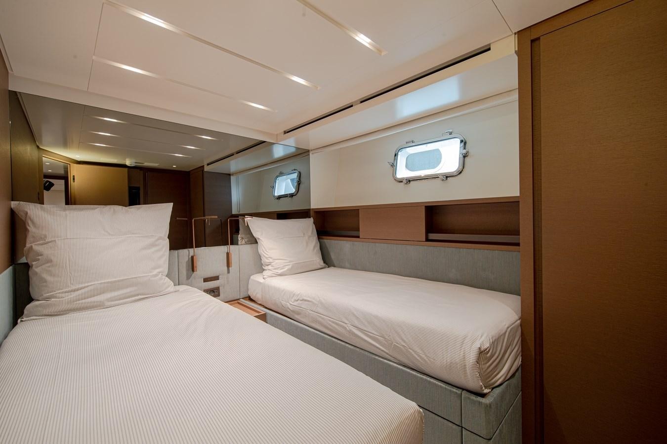 a room with two beds aboard REGINE Yacht for Sale