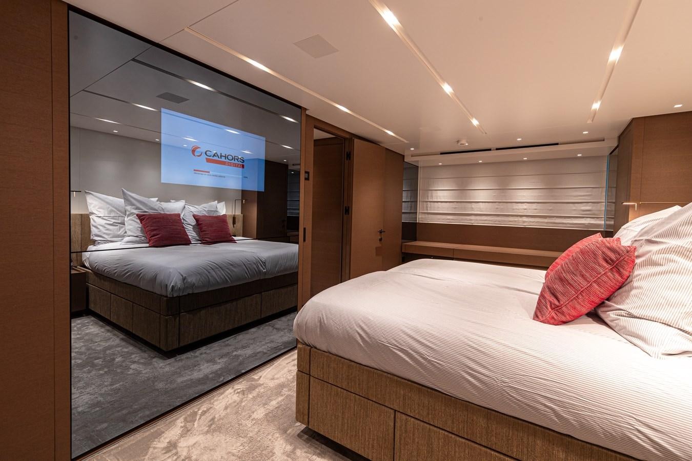 a room with two beds aboard REGINE Yacht for Sale