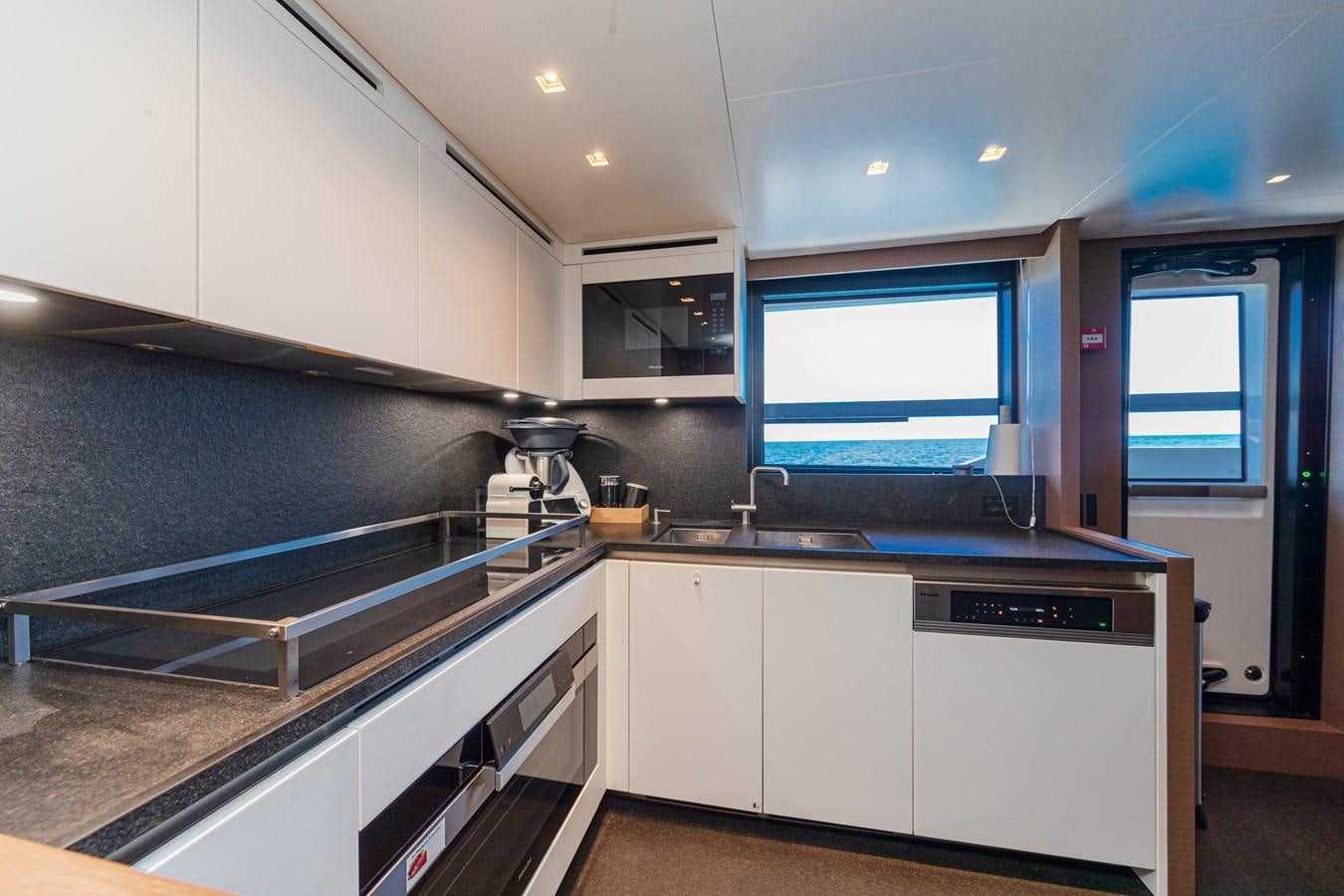 a kitchen with a large island aboard REGINE Yacht for Sale