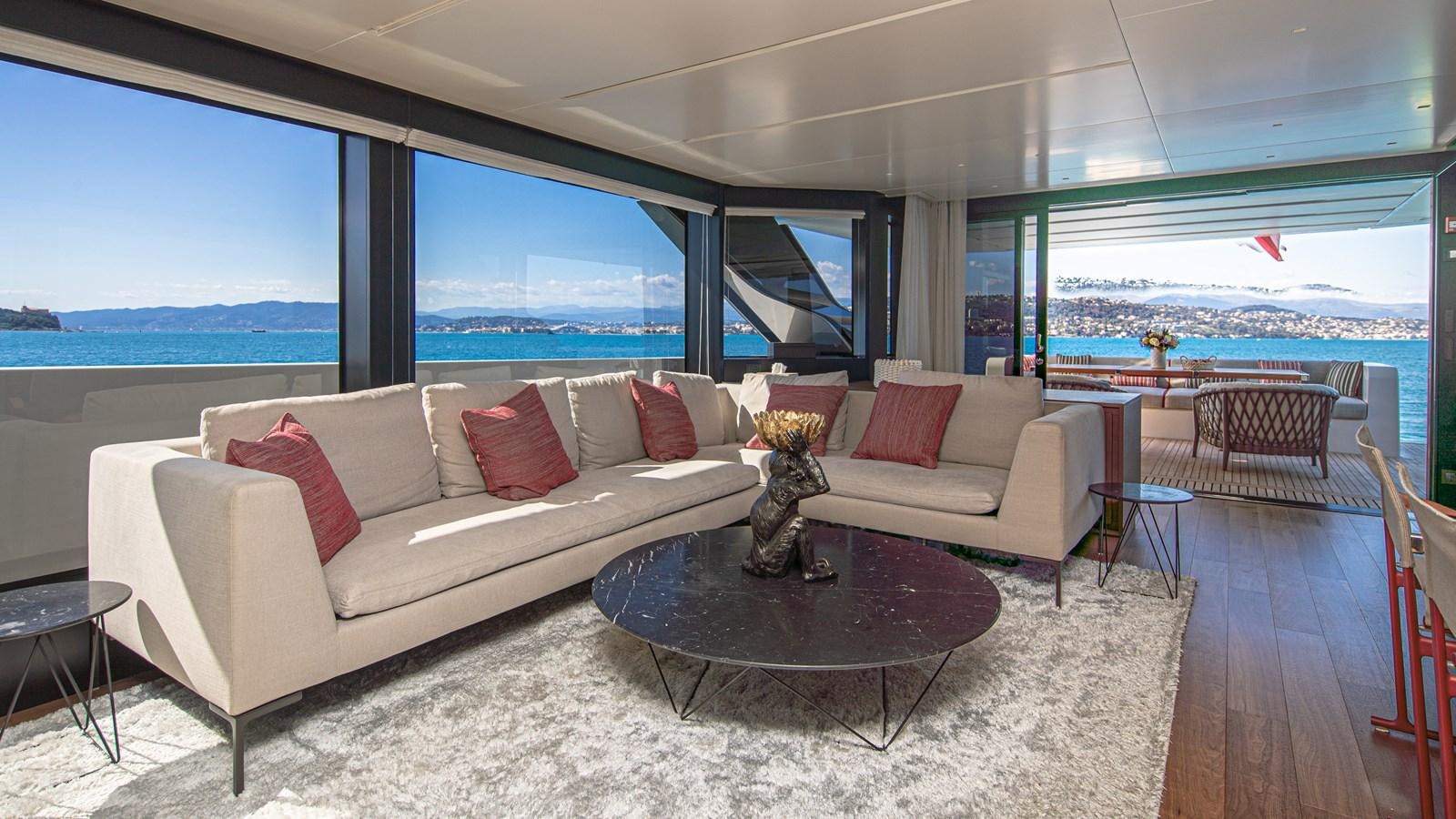 a living room with a large window aboard REGINE Yacht for Sale