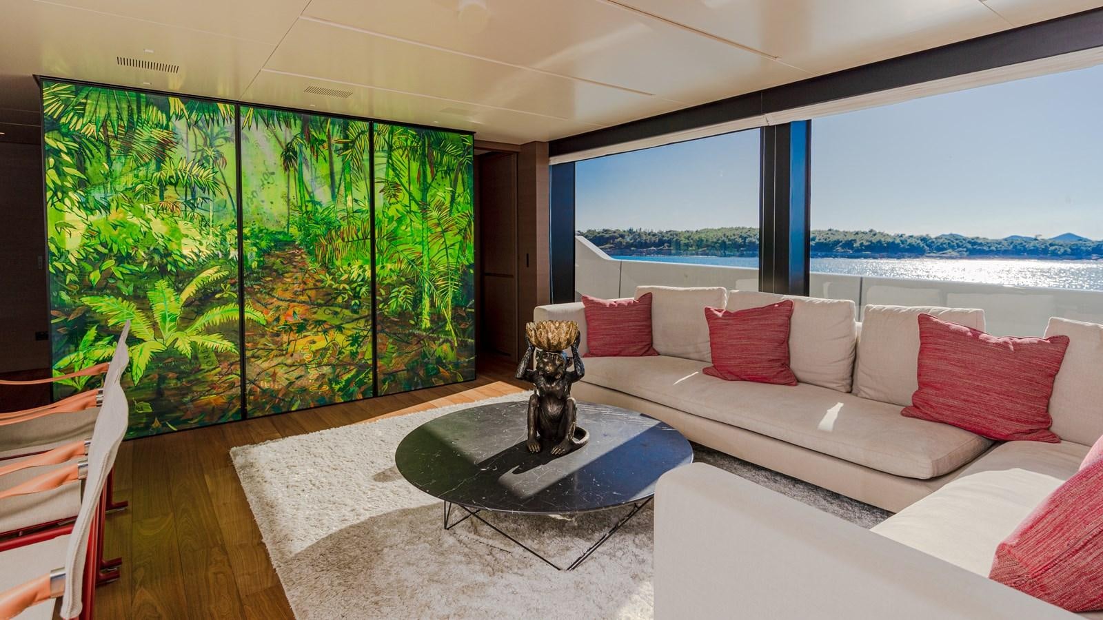 a living room with a large window aboard REGINE Yacht for Sale