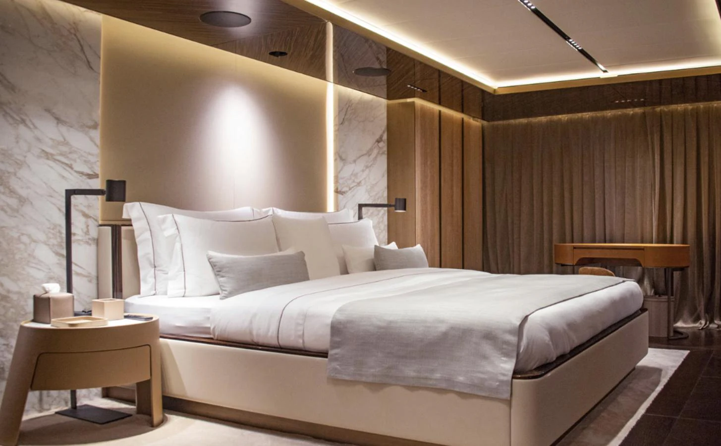 a bed with white sheets aboard ADMIRAL S-FORCE 55 Yacht for Sale