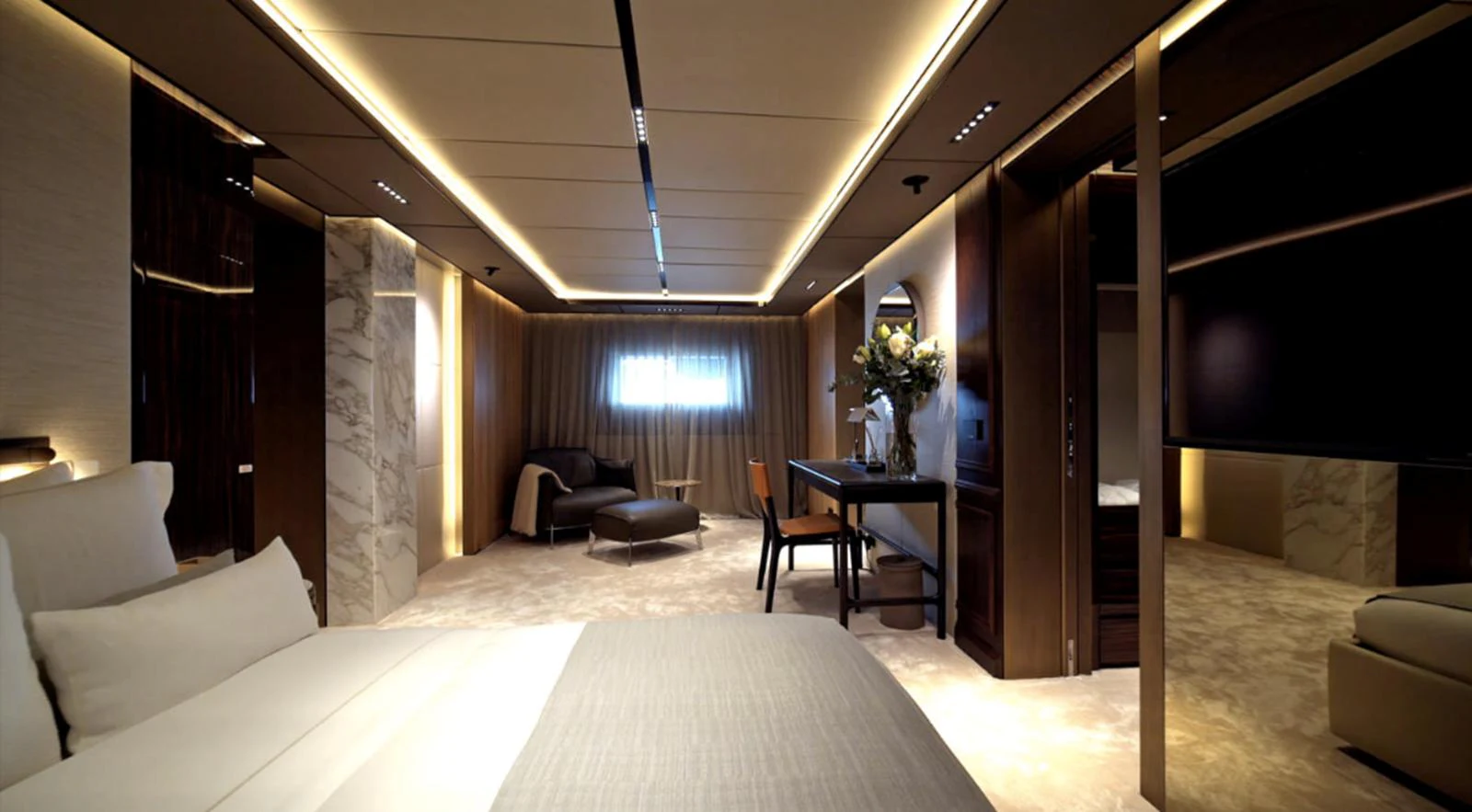 a room with a bed and a table aboard ADMIRAL S-FORCE 55 Yacht for Sale