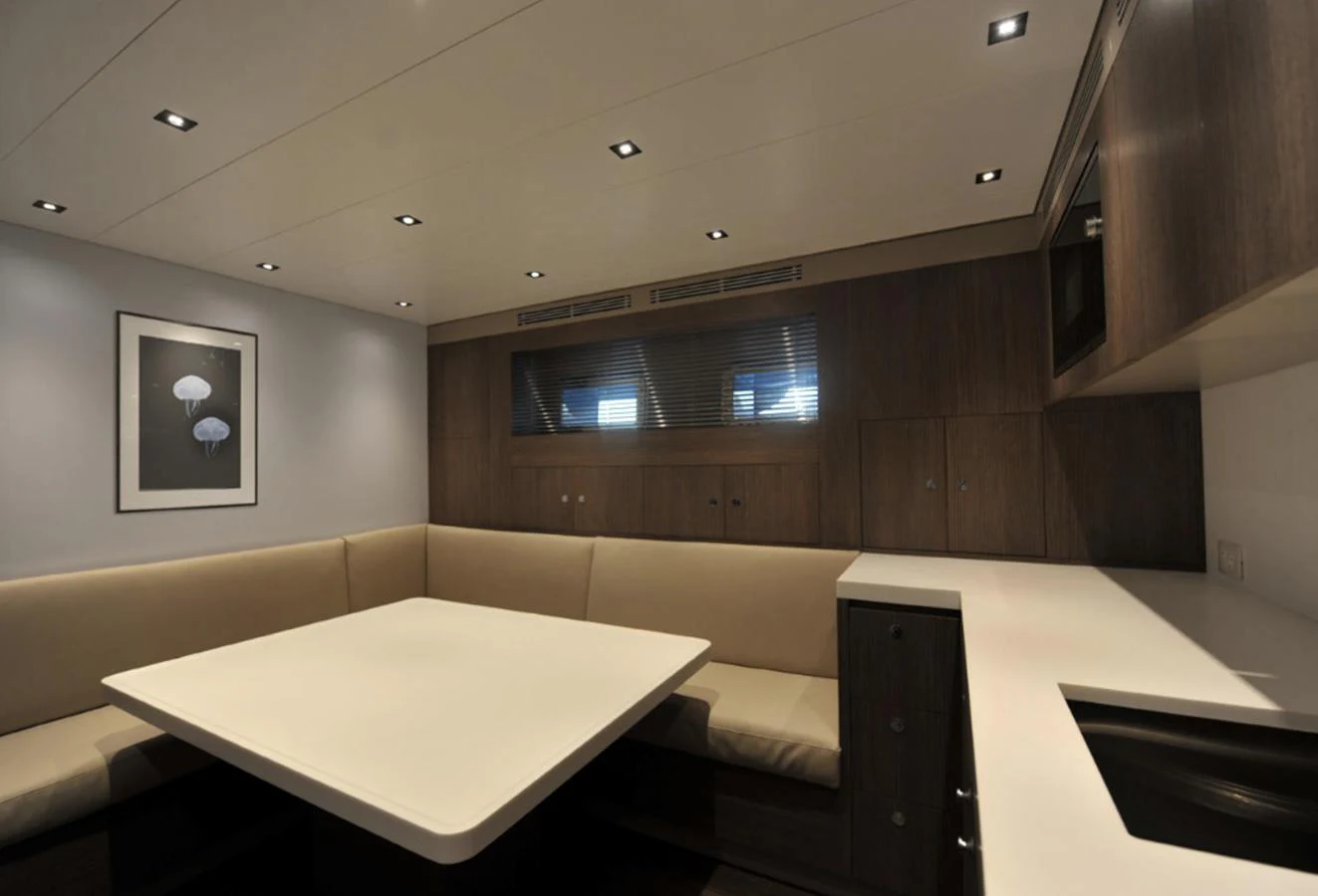 a room with couches and a table aboard ADMIRAL S-FORCE 55 Yacht for Sale