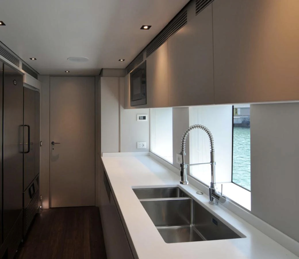 a kitchen with a sink and a large window aboard ADMIRAL S-FORCE 55 Yacht for Sale