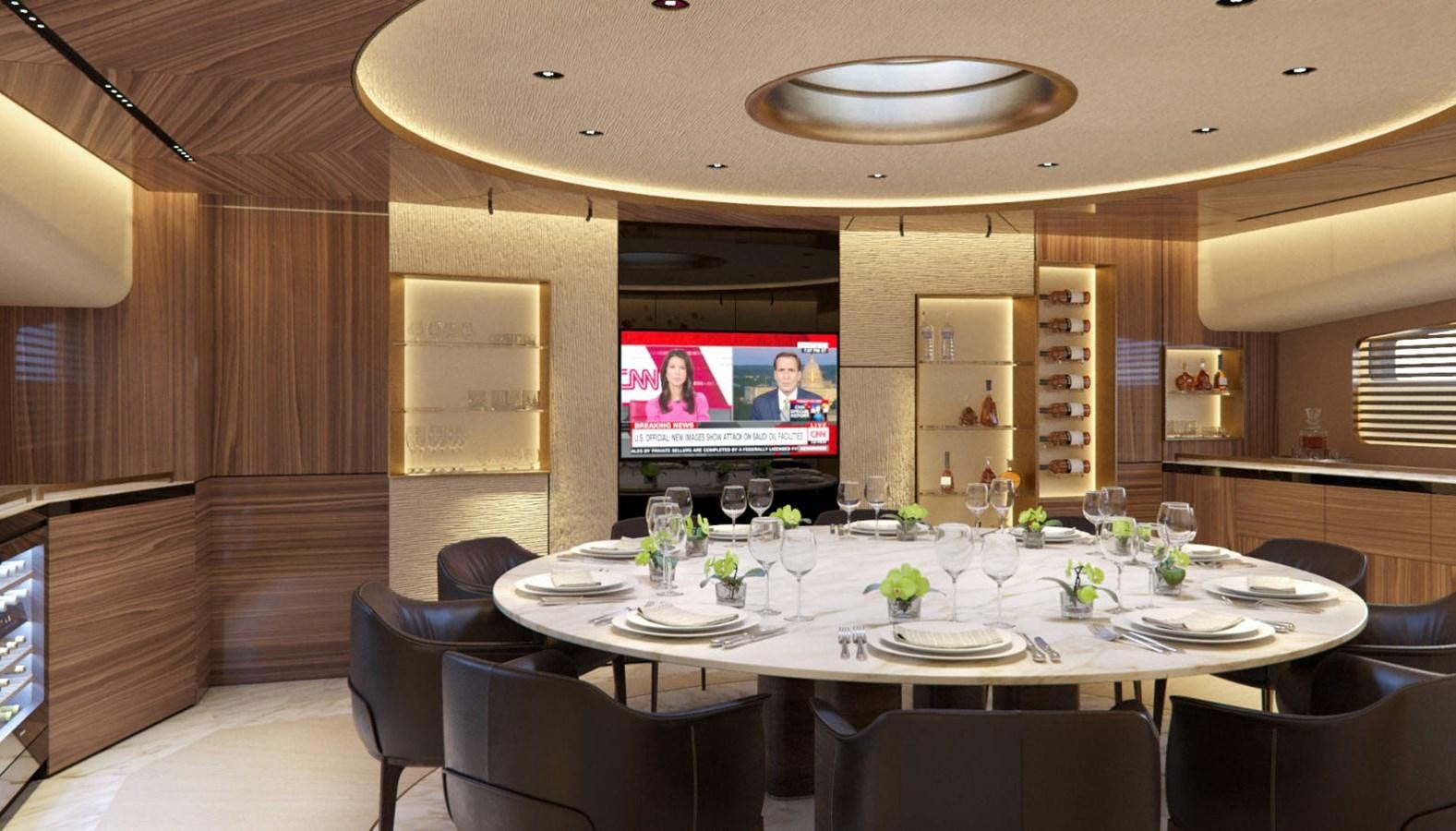 a large room with a table and chairs and a tv aboard EVO 120 Yacht for Sale