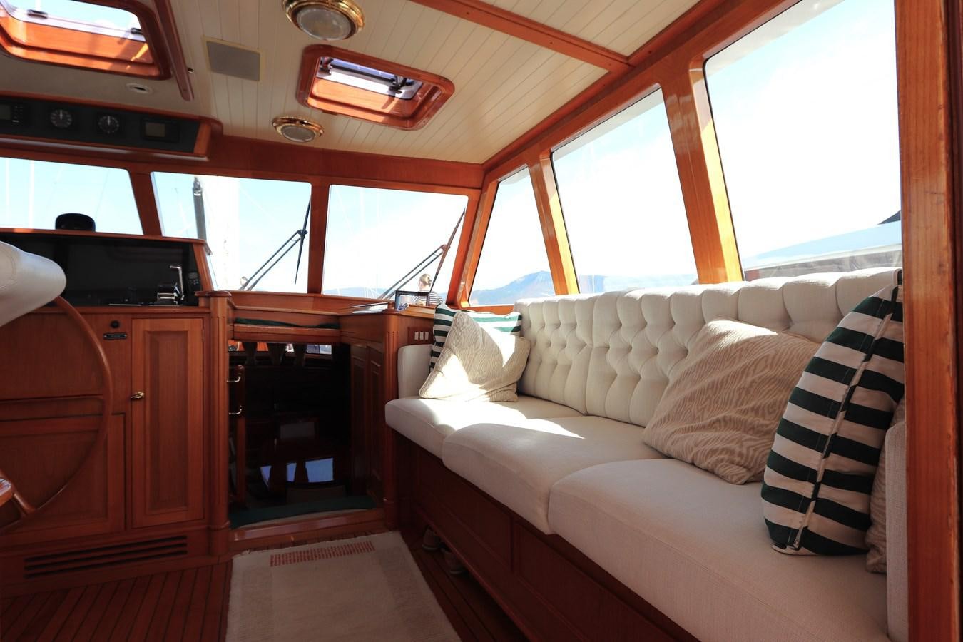 a boat with a couch aboard KEEWAYDIN Yacht for Sale
