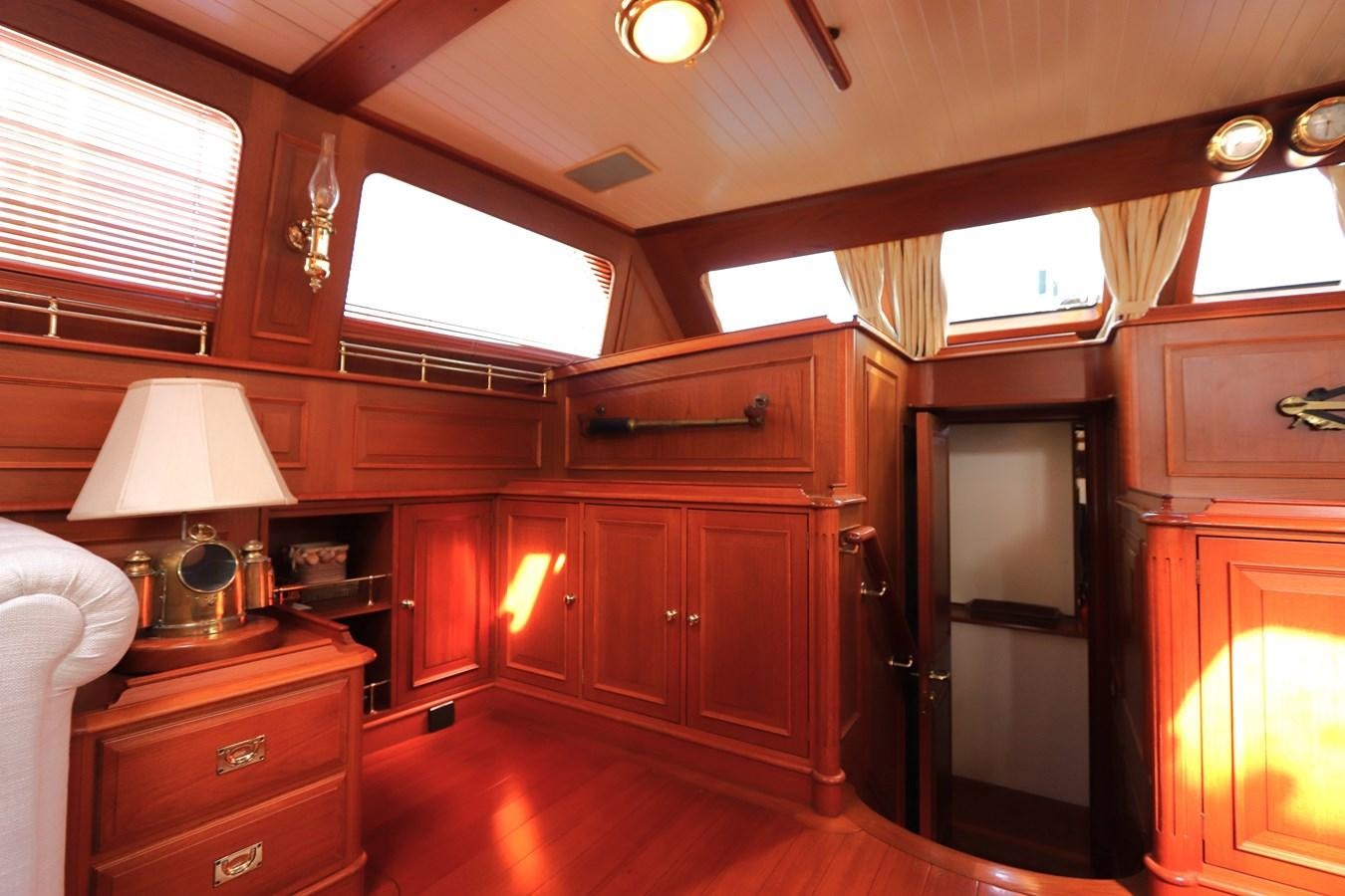a room with a bed and a desk aboard KEEWAYDIN Yacht for Sale