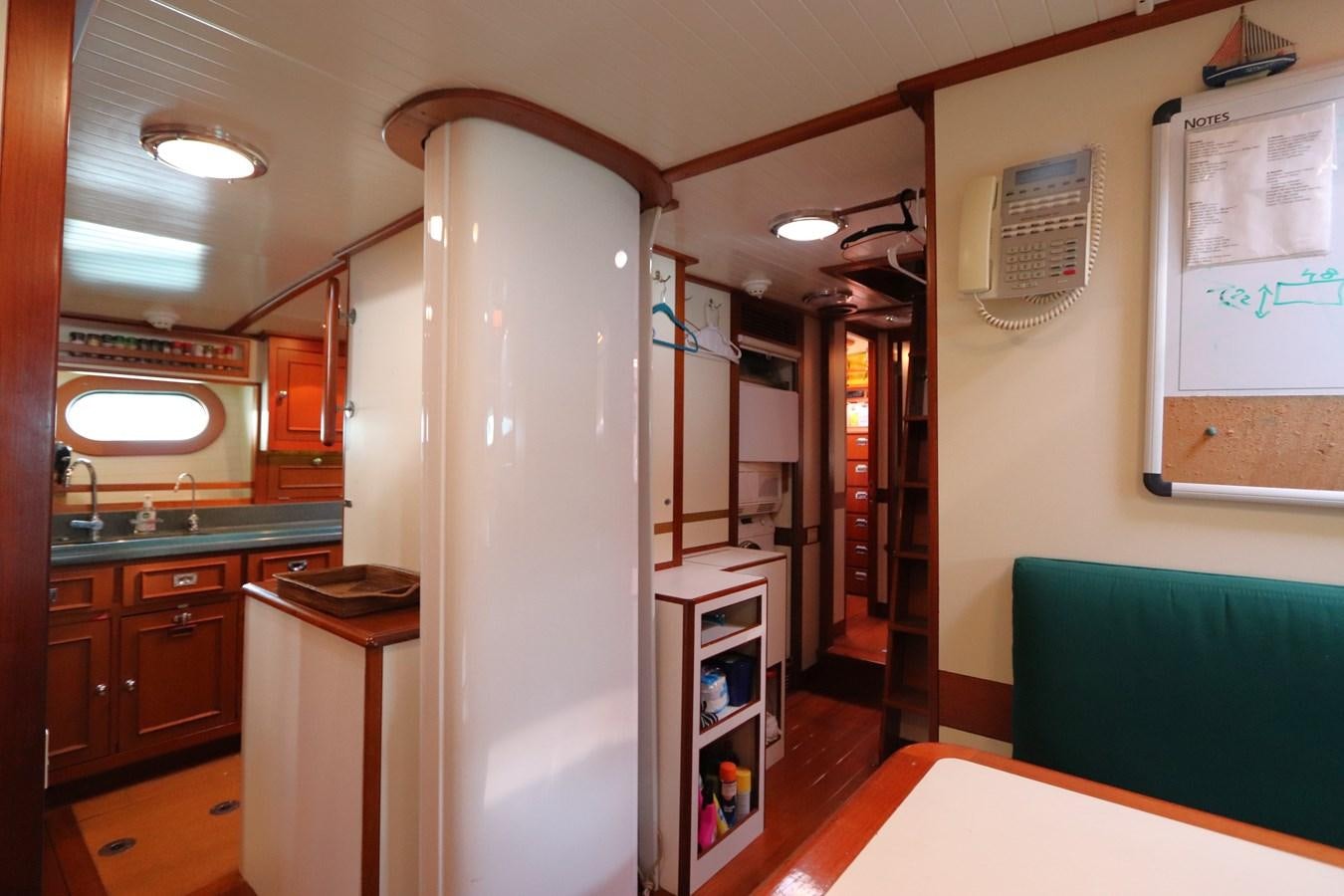 a room with a white surfboard aboard KEEWAYDIN Yacht for Sale