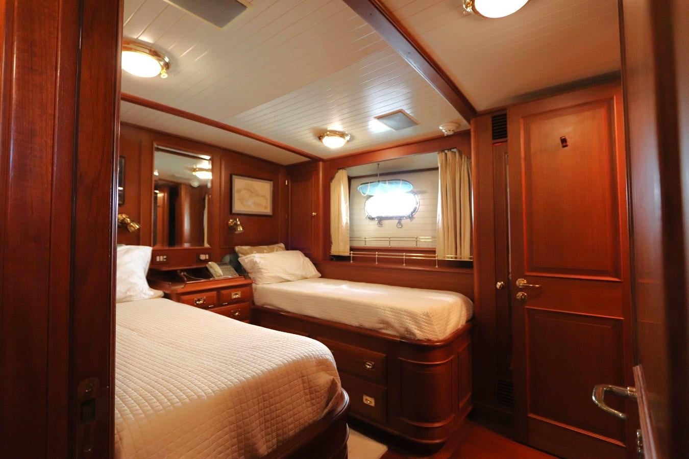 a couple of beds in a hotel room aboard KEEWAYDIN Yacht for Sale