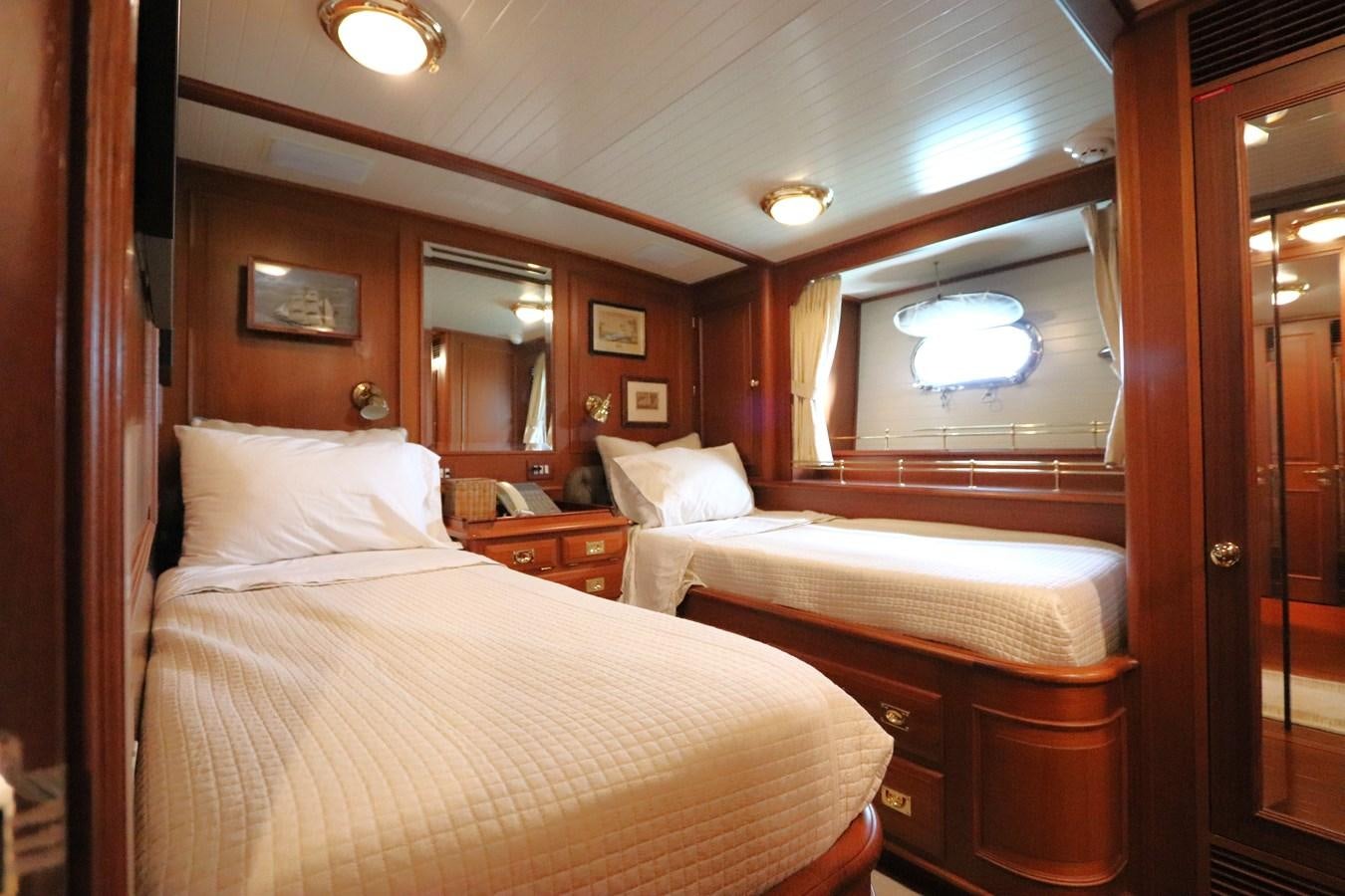 a room with two beds aboard KEEWAYDIN Yacht for Sale