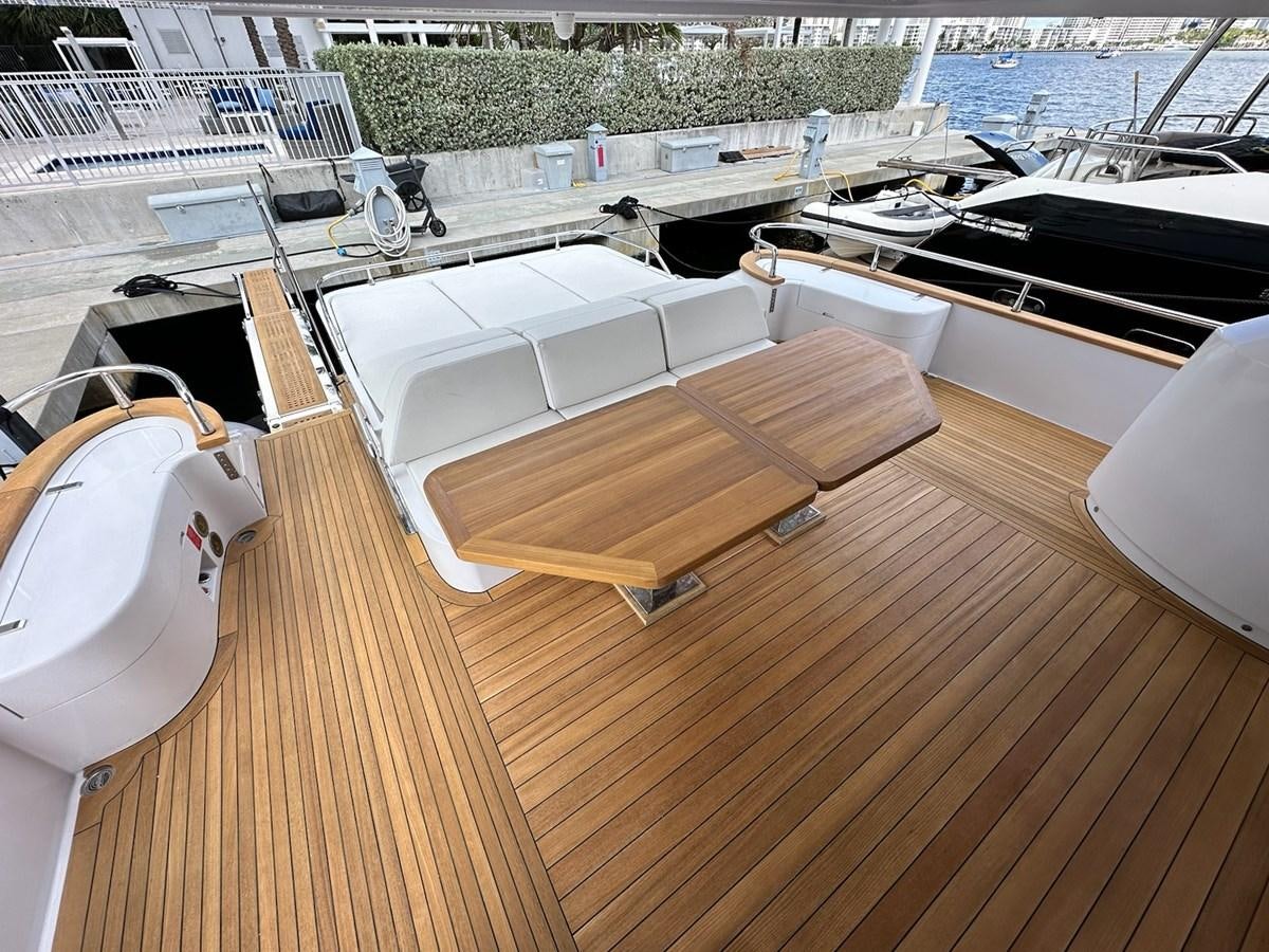 a deck with a deck and boats aboard AMER 94 Yacht for Sale