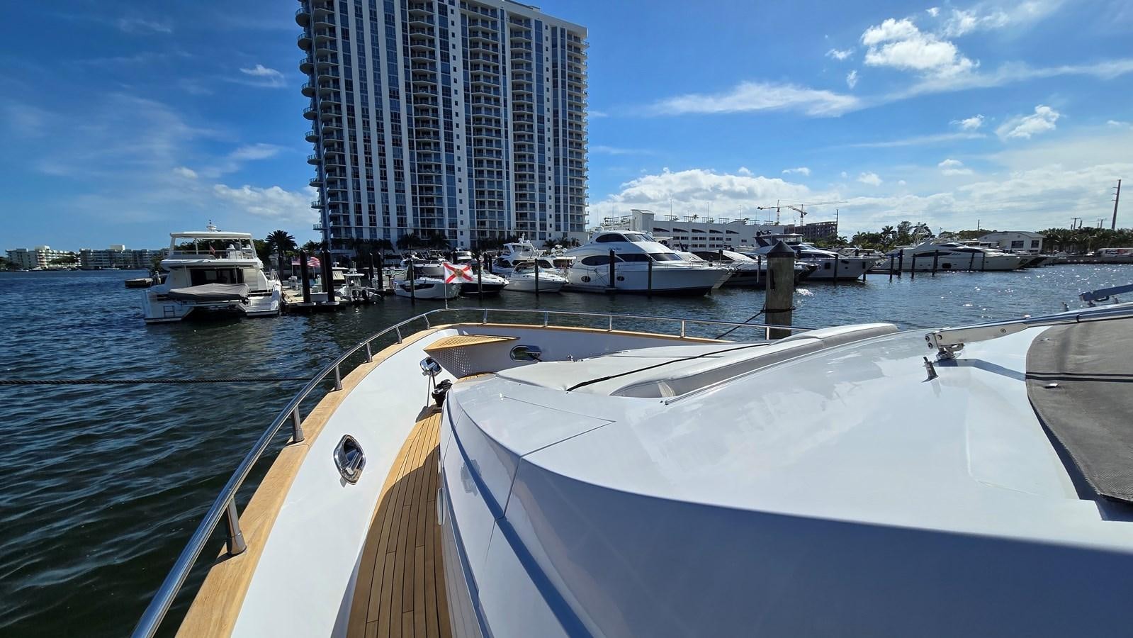 a boat is parked at a dock aboard AMER 94 Yacht for Sale
