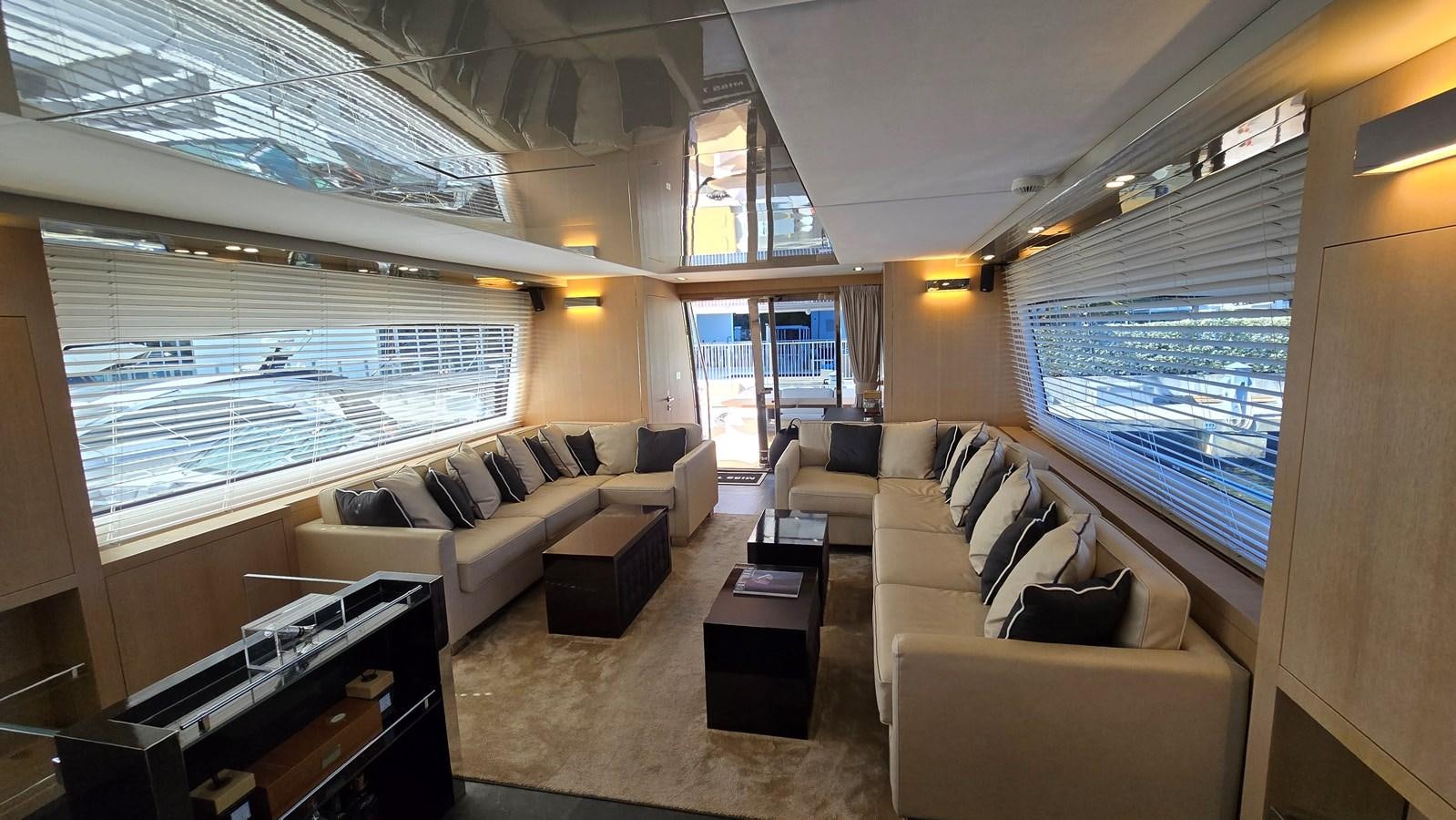 a living room with a large window aboard AMER 94 Yacht for Sale