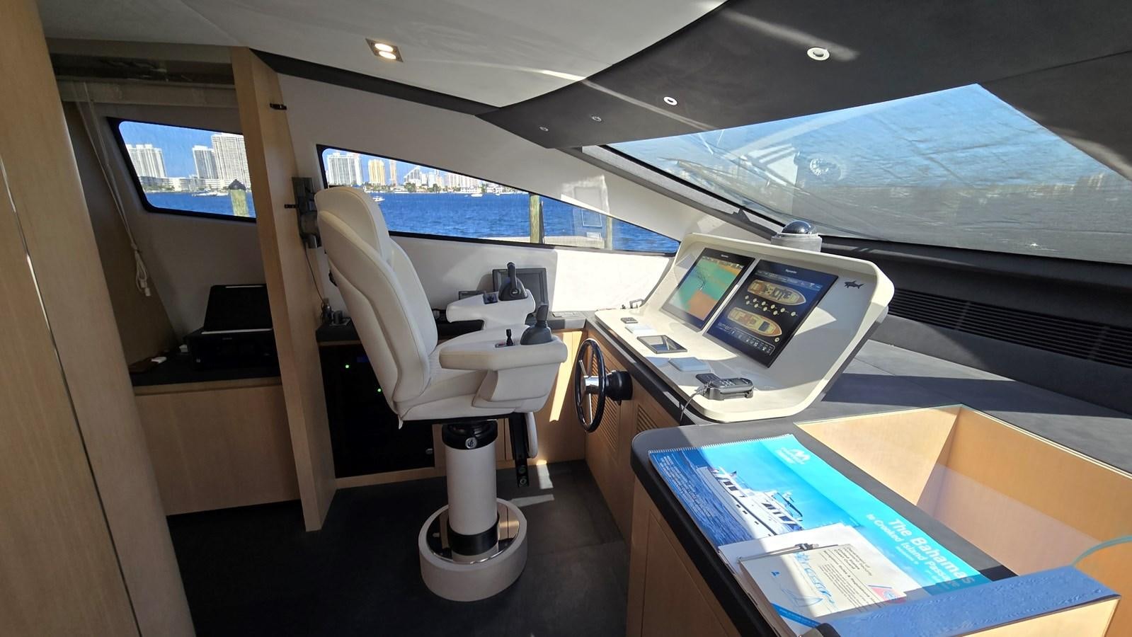 a room with a desk and a computer aboard AMER 94 Yacht for Sale