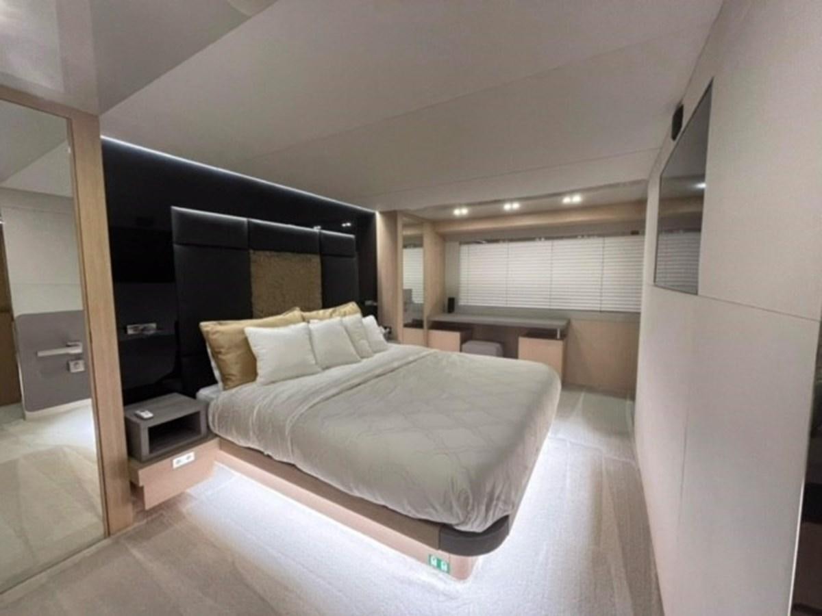 a large bedroom with a large bed aboard AMER 94 Yacht for Sale