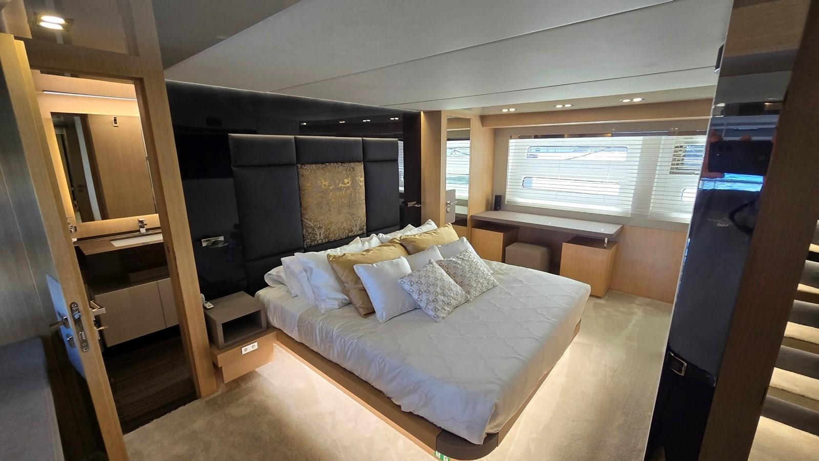 a bed in a room aboard AMER 94 Yacht for Sale