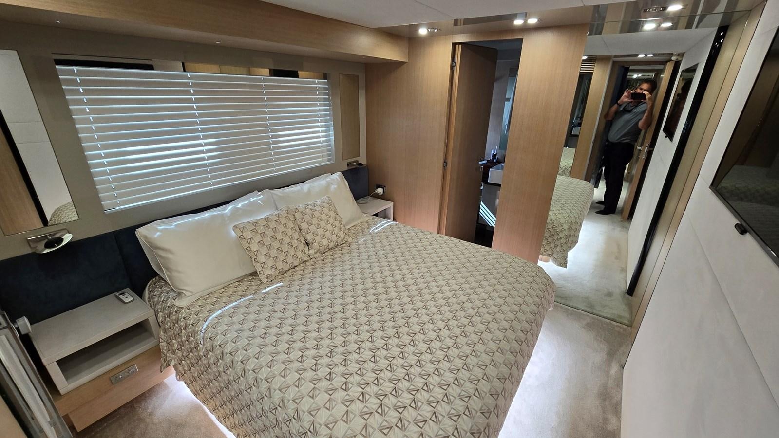 a bed in a hotel room aboard AMER 94 Yacht for Sale