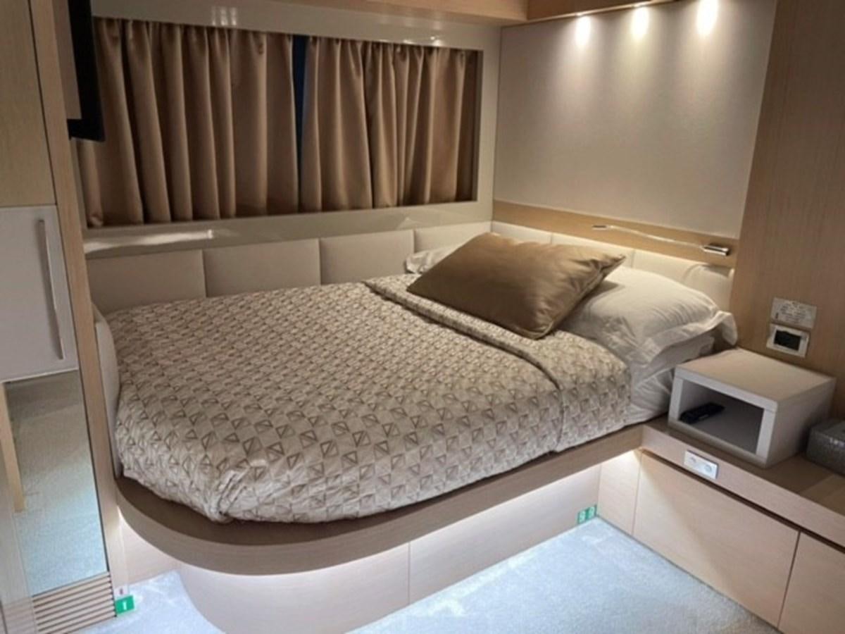 a bed with a white sheet aboard AMER 94 Yacht for Sale
