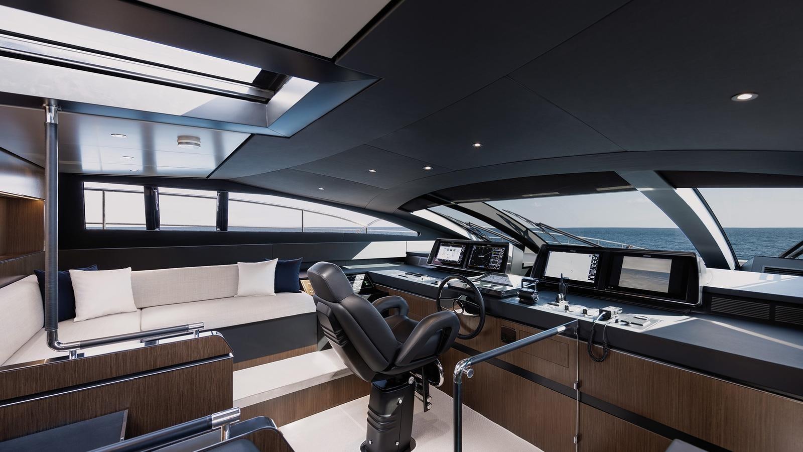 a room with a couch and a table and a chair aboard THREE GRACES Yacht for Sale