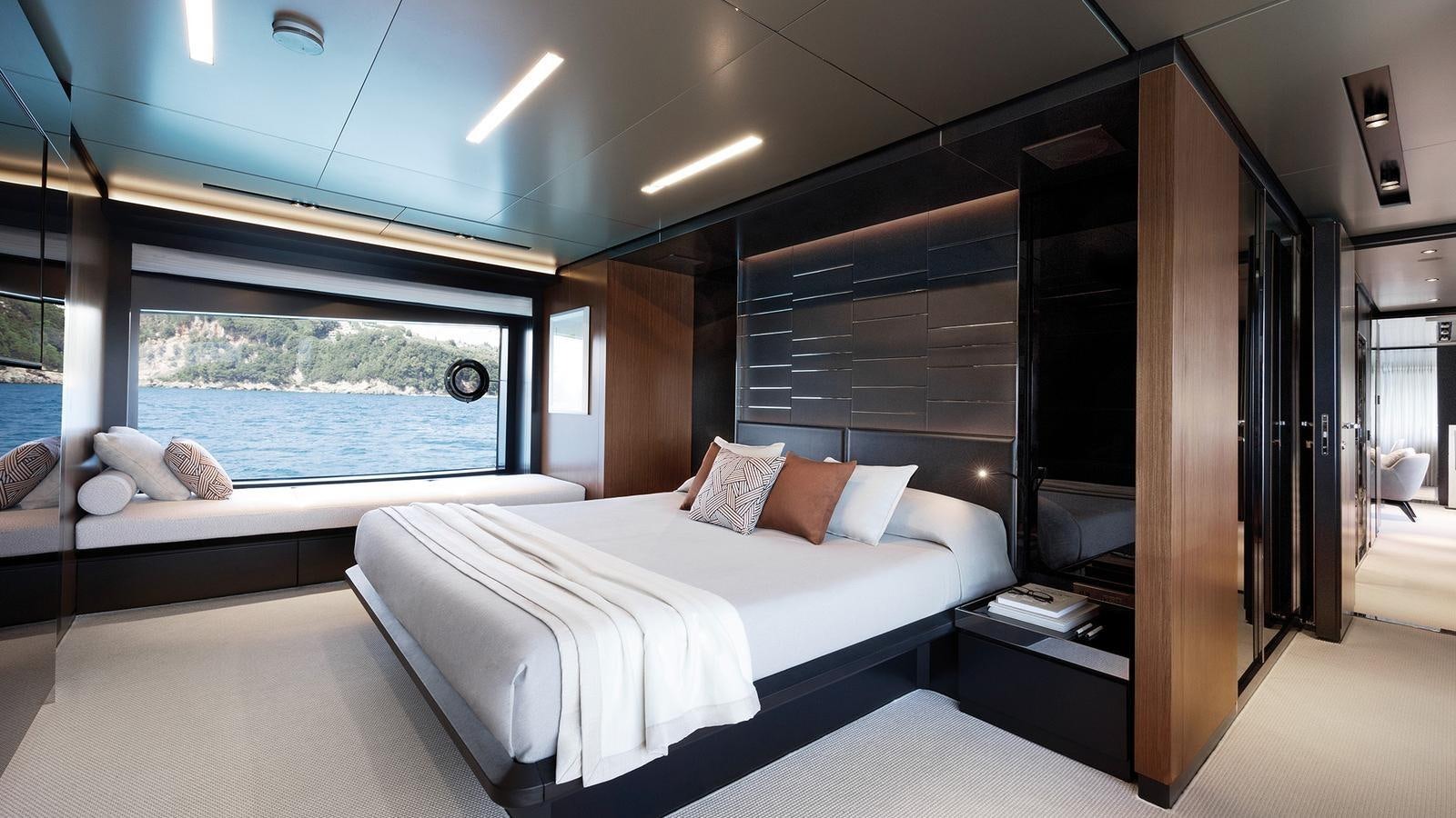 a room with a bed and a window aboard THREE GRACES Yacht for Sale