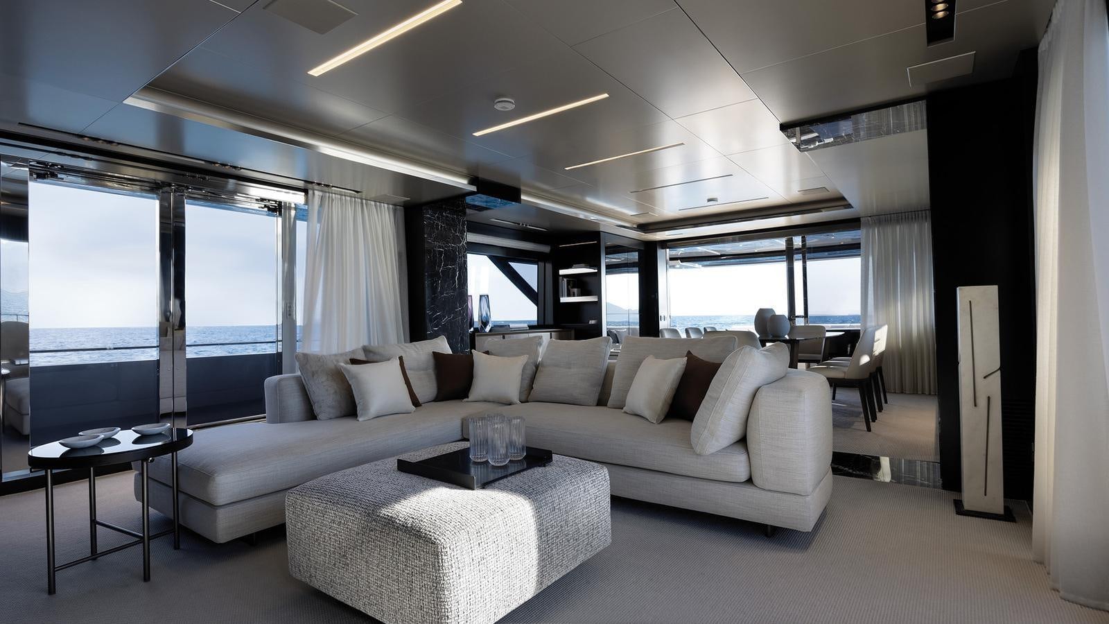 a living room with a large window aboard THREE GRACES Yacht for Sale