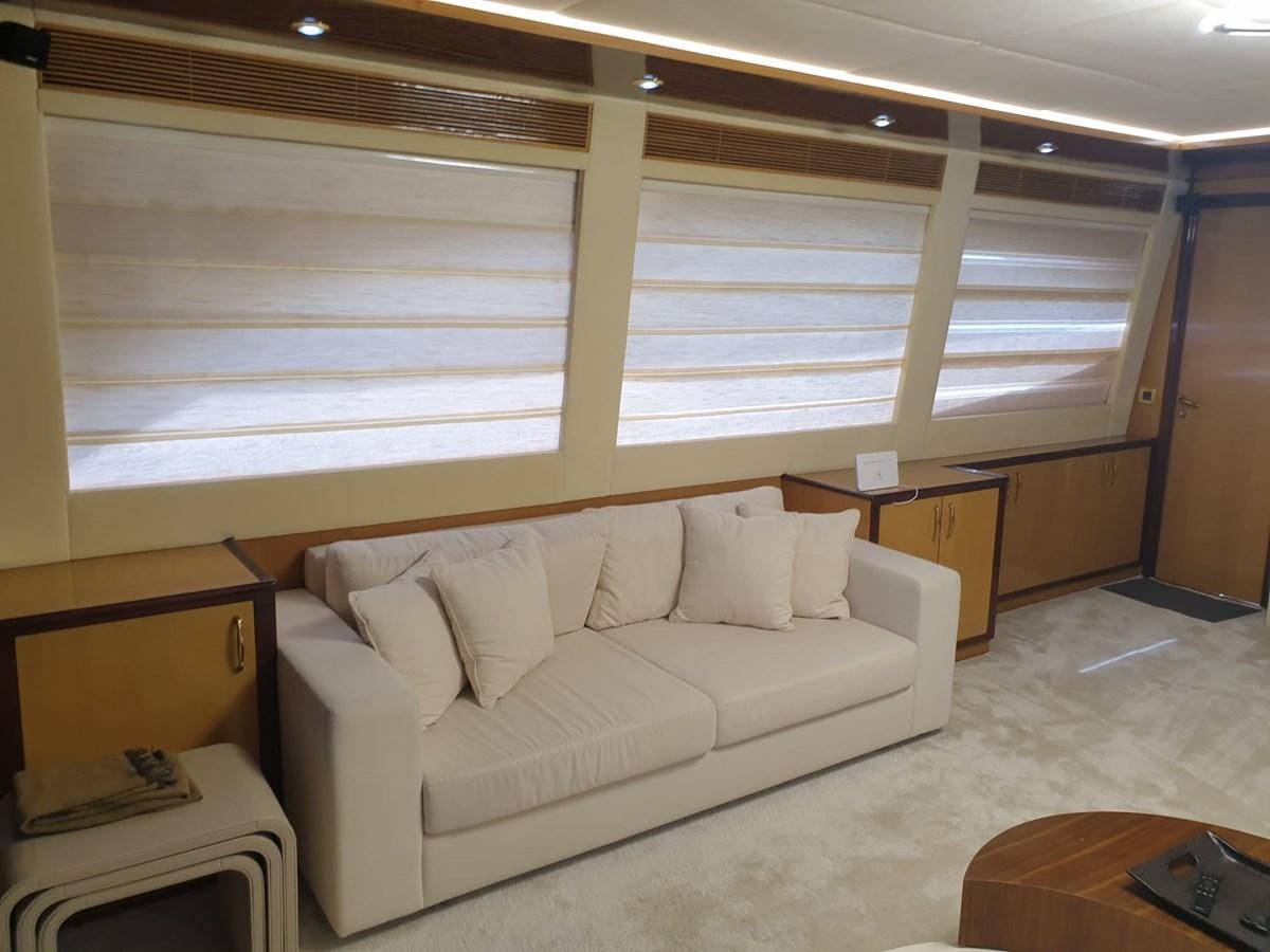 a room with a couch and a desk aboard NIKE III Yacht for Sale