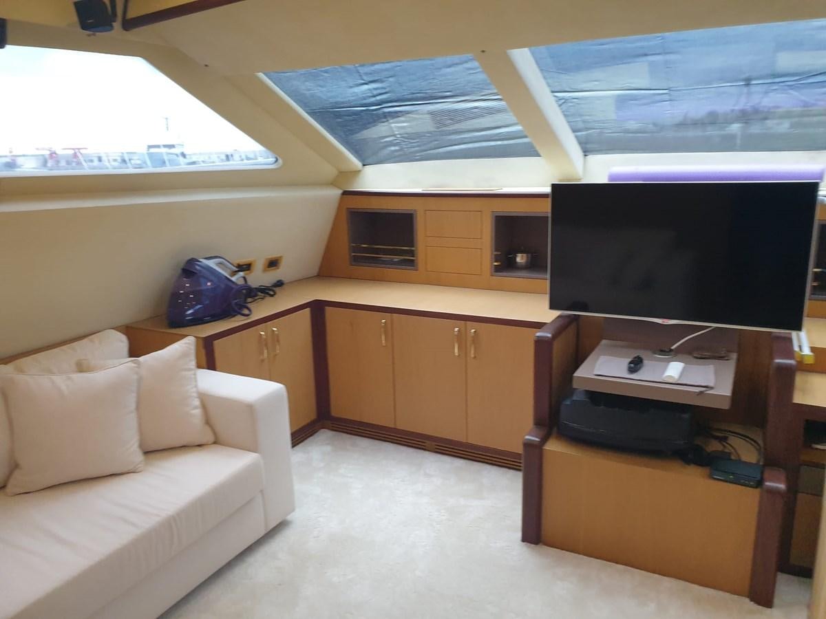 a room with a bed and a tv aboard NIKE III Yacht for Sale
