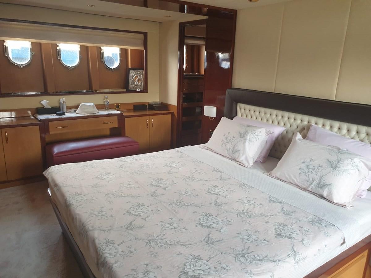 a bed with white sheets aboard NIKE III Yacht for Sale