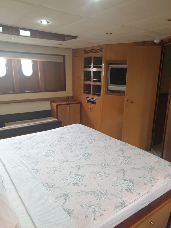 a bedroom with a large bed aboard NIKE III Yacht for Sale