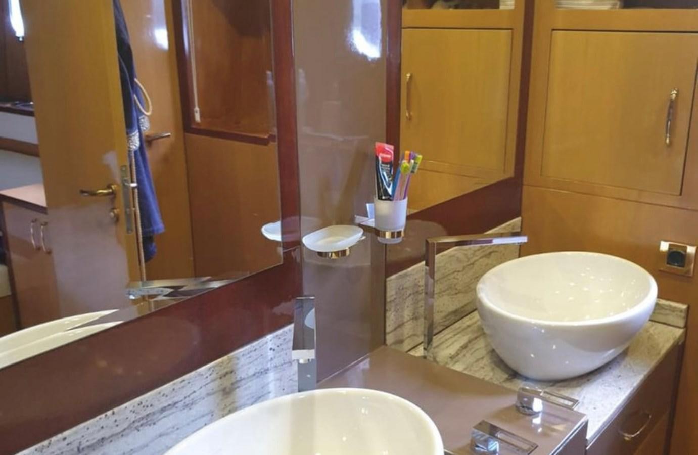 a bathroom with a large mirror aboard NIKE III Yacht for Sale