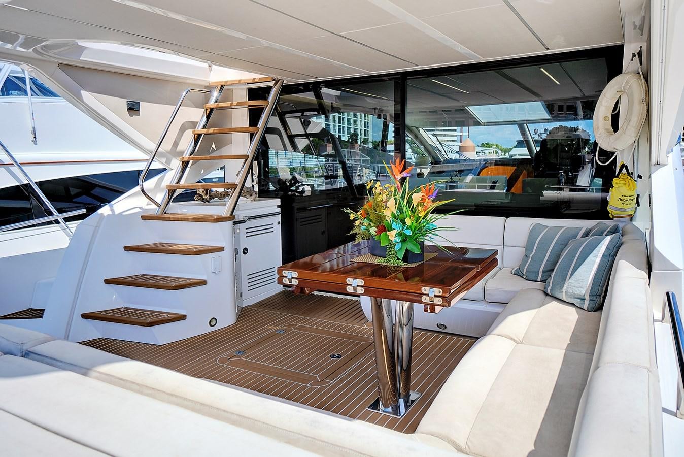 inside of a vehicle with a table and a chair aboard ONCE AROUND Yacht for Sale