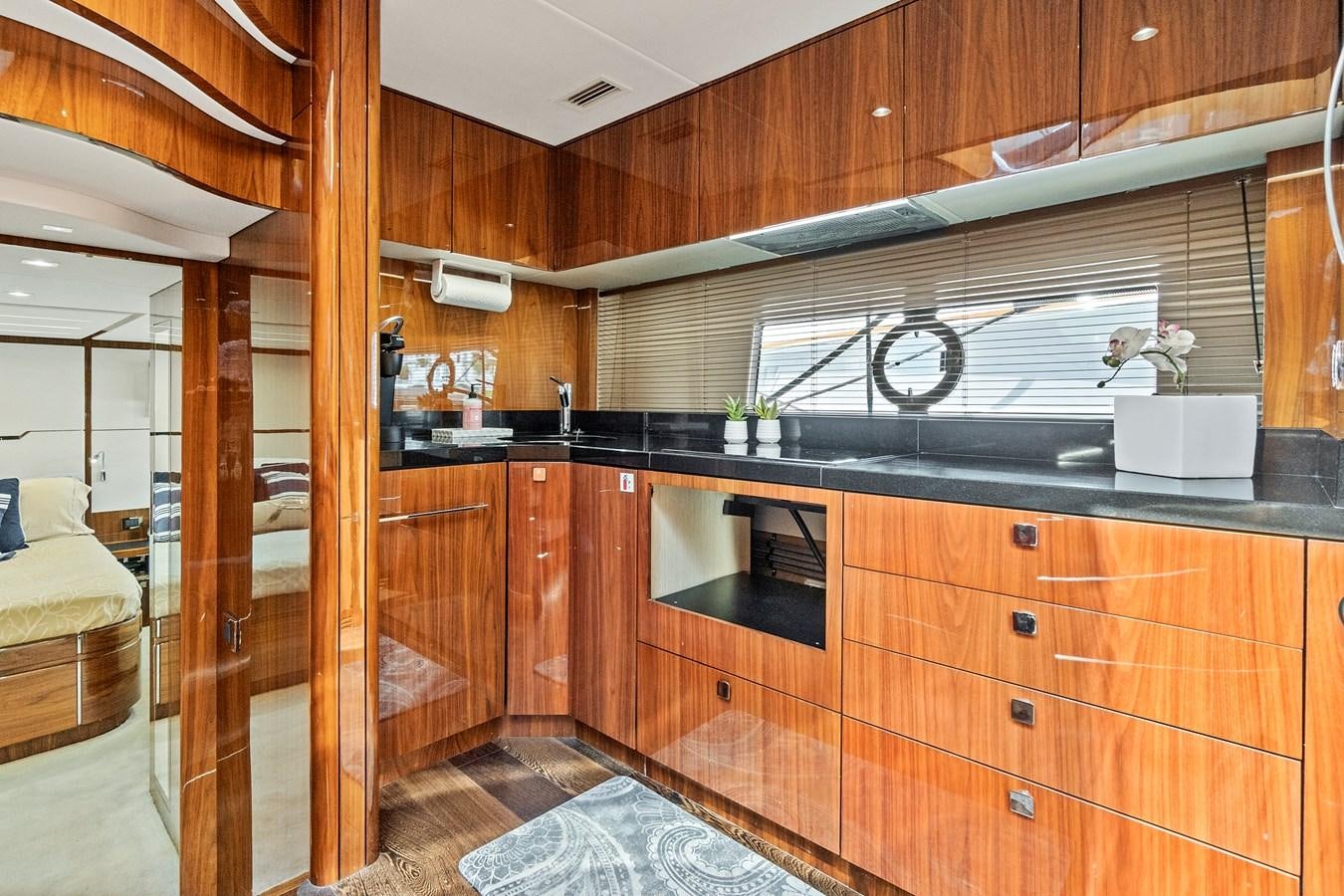 a kitchen with wooden cabinets aboard ONCE AROUND Yacht for Sale