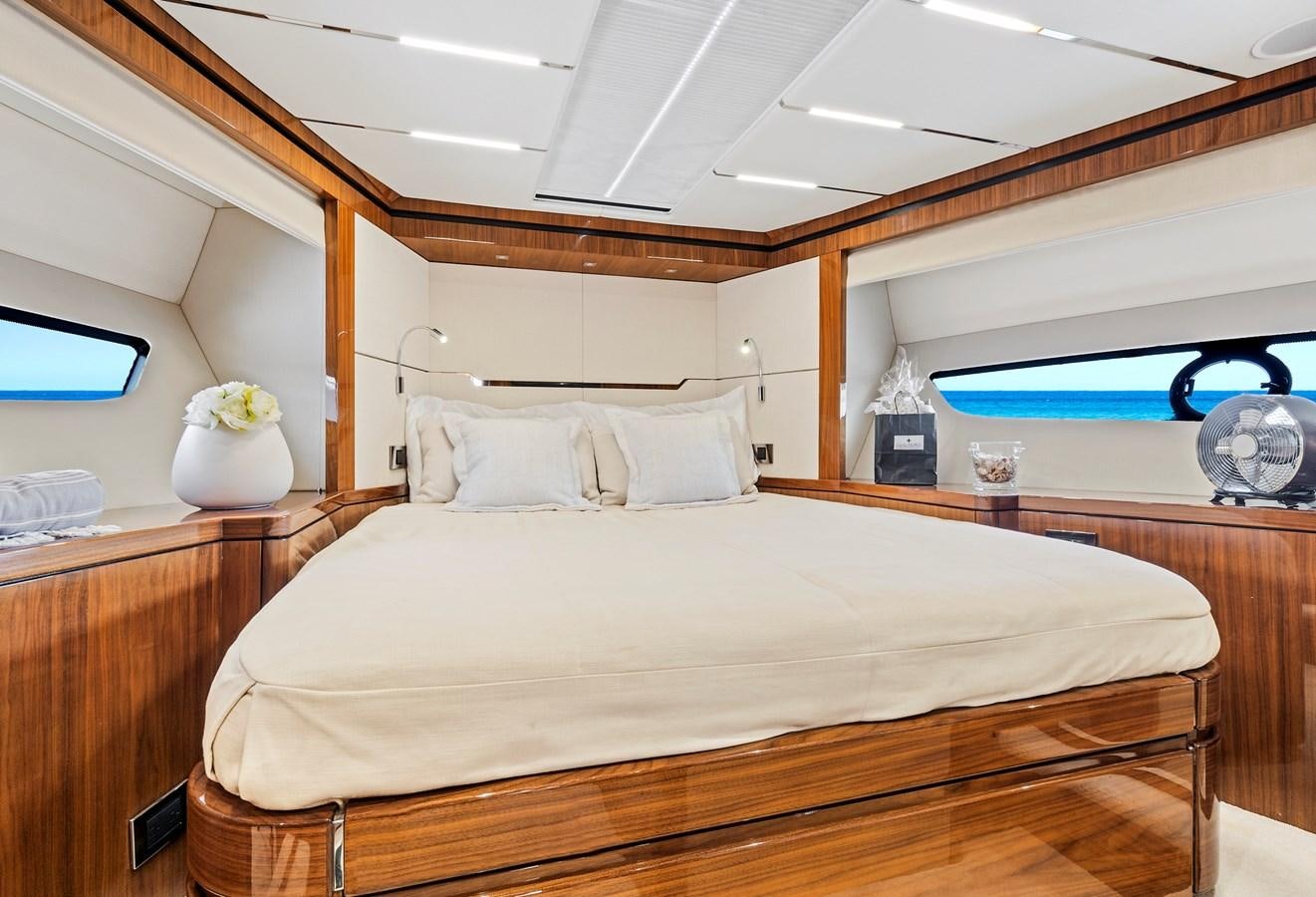 a bed with a white bed spread aboard ONCE AROUND Yacht for Sale