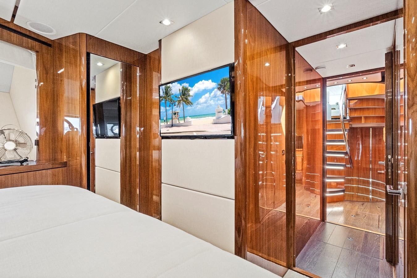 a room with a bed and a closet aboard ONCE AROUND Yacht for Sale