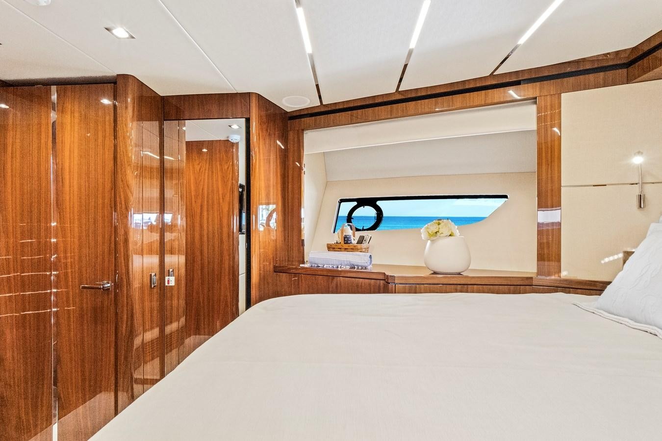 a bedroom with a bed and a wood wall aboard ONCE AROUND Yacht for Sale
