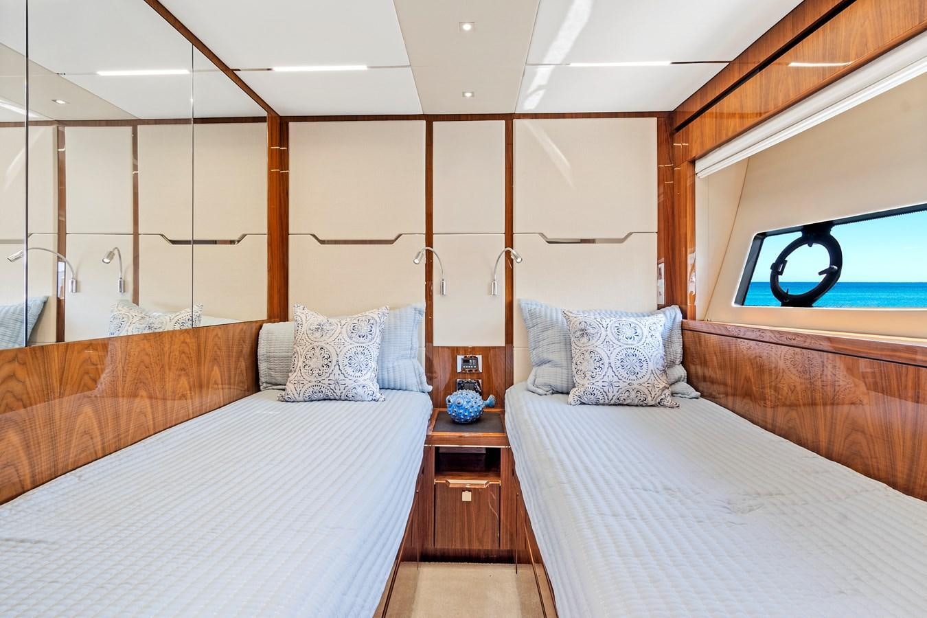 a bedroom with two beds aboard ONCE AROUND Yacht for Sale