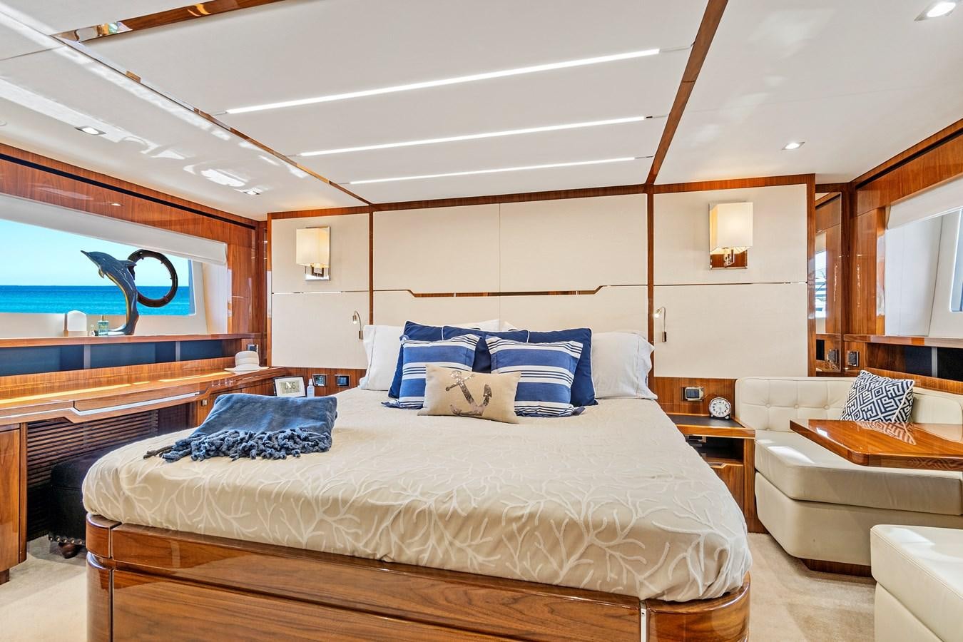 a bedroom with a bed and a couch aboard ONCE AROUND Yacht for Sale