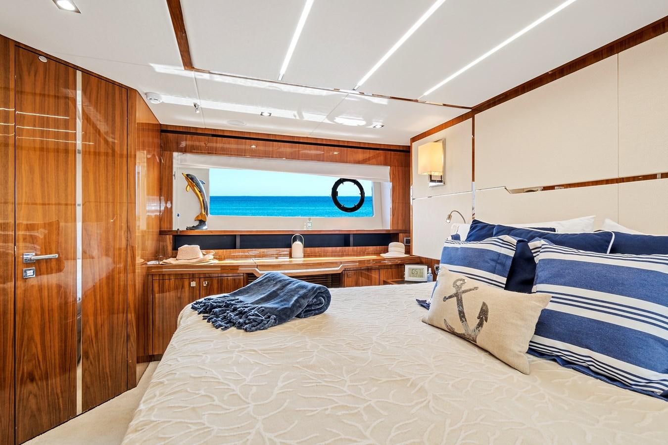 a room with a bed and a wood door aboard ONCE AROUND Yacht for Sale