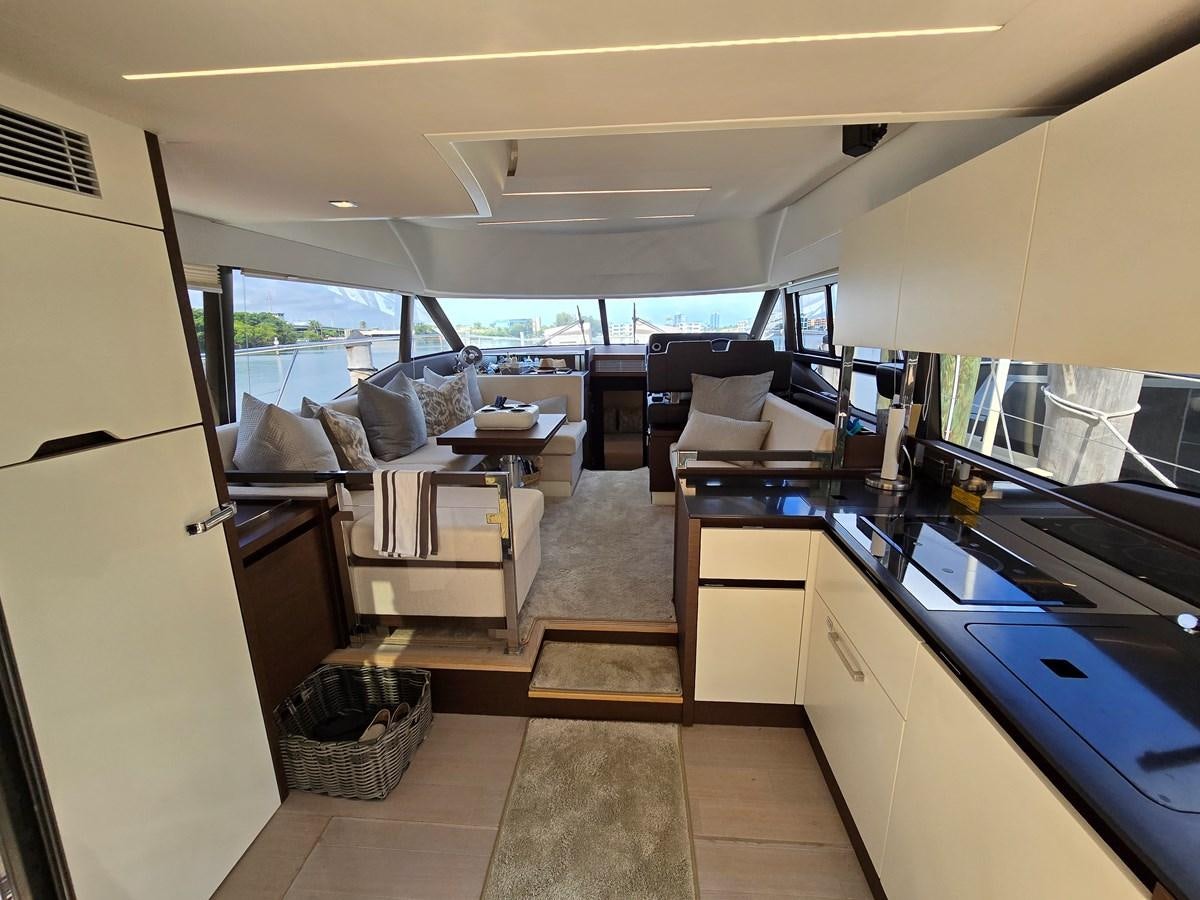 a kitchen with a couch and a table aboard OPUS ONE Yacht for Sale