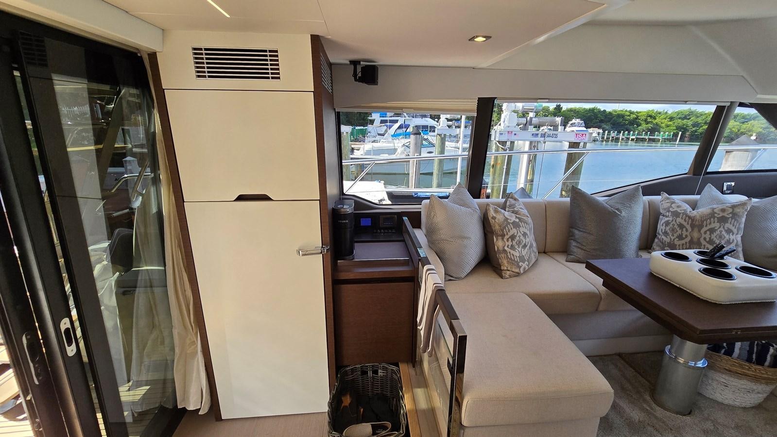 a living room with a couch and a table aboard OPUS ONE Yacht for Sale