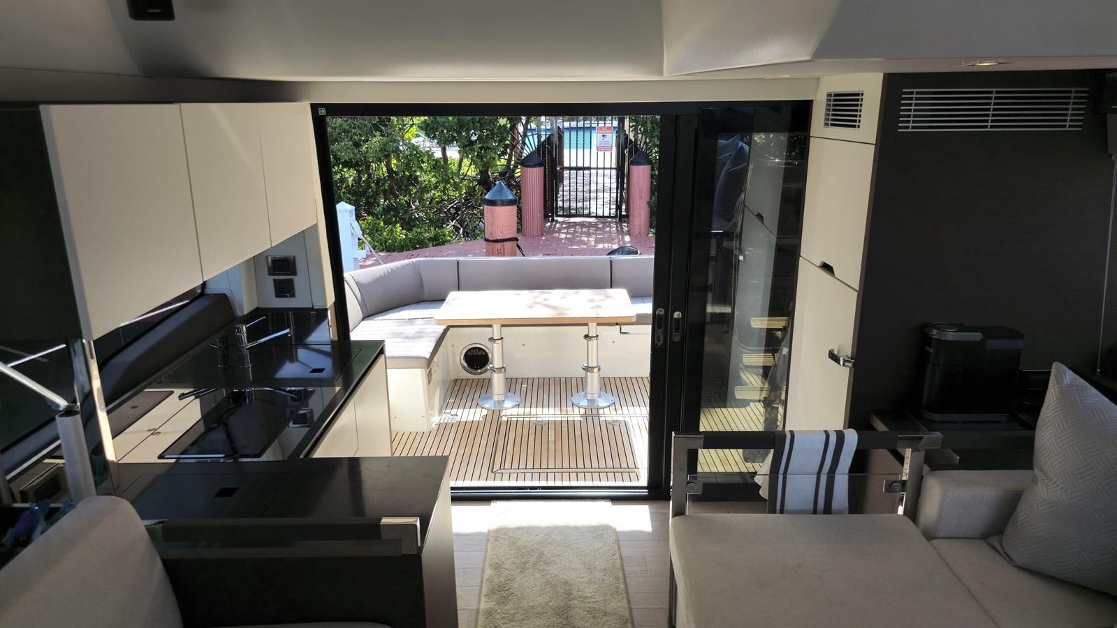 a room with a table and chairs aboard OPUS ONE Yacht for Sale