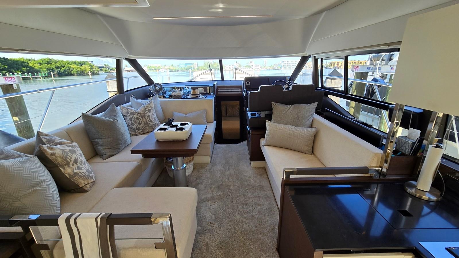 a living room with a couch and a table aboard OPUS ONE Yacht for Sale