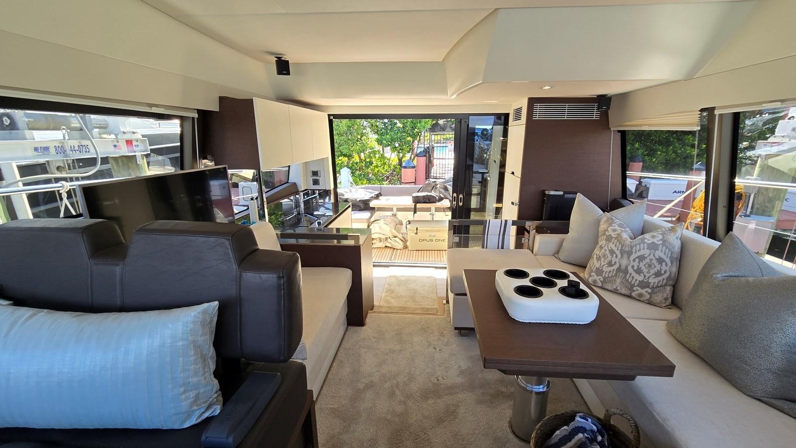 a living room with a couch and a coffee table aboard OPUS ONE Yacht for Sale