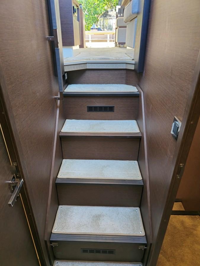 a wooden cabinet with drawers aboard OPUS ONE Yacht for Sale