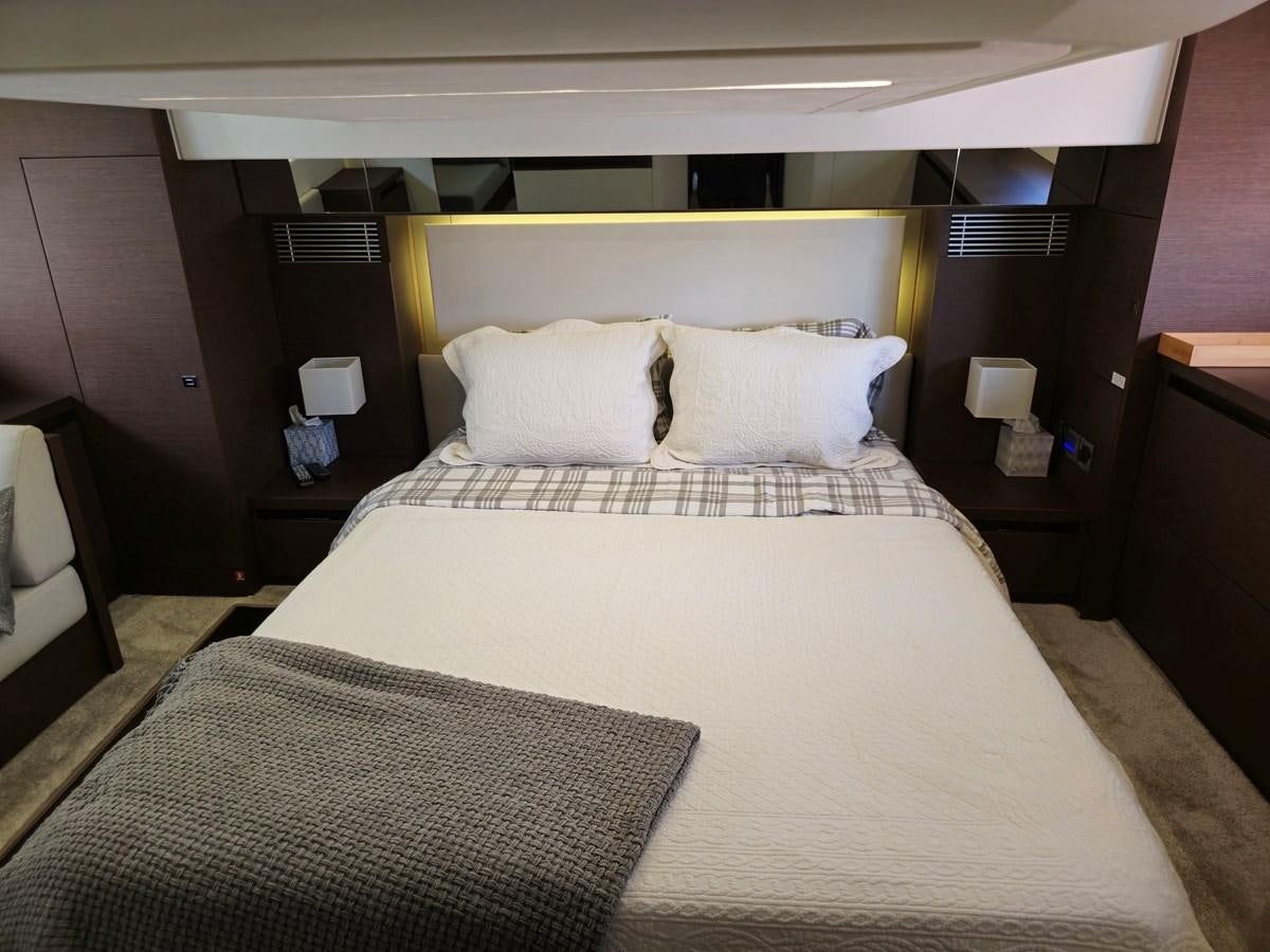 a bed with white sheets aboard OPUS ONE Yacht for Sale