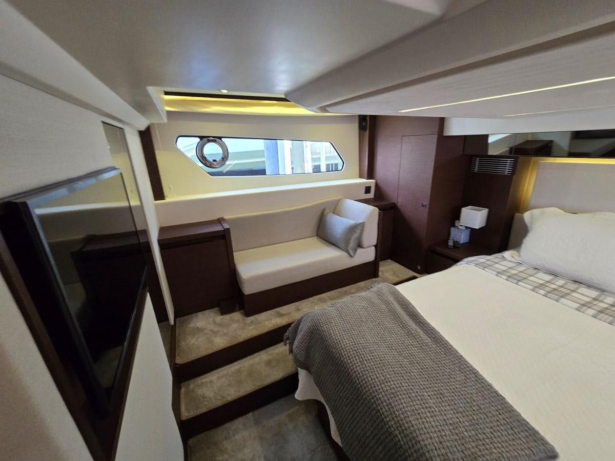 a room with a bed and a window aboard OPUS ONE Yacht for Sale