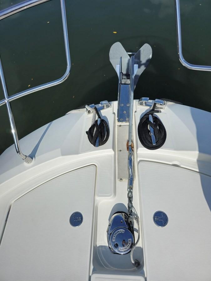a white boat with a blue handle aboard OPUS ONE Yacht for Sale