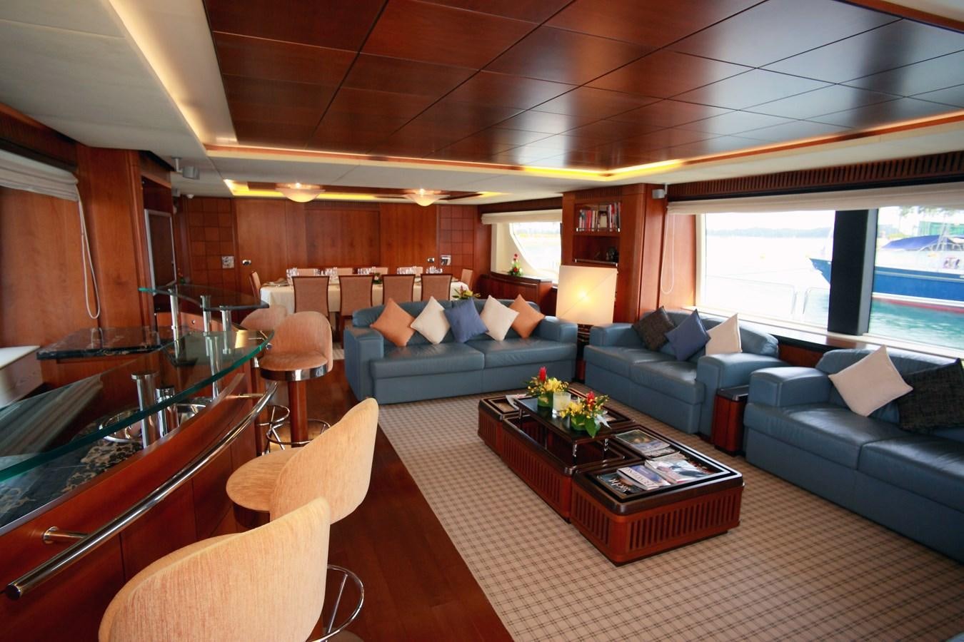 a living room with a large window aboard HYE SEAS II Yacht for Sale